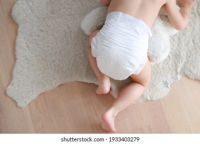 Motion Blurred Of Baby In Diaper Crawling And Playing On The Floor. Motion Movement Infant Boy Crawl With Copy Space For Text.