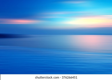 Motion blurred background refraction in water  Panoramic dramatic view Infinity sunset the sea at twilight times 