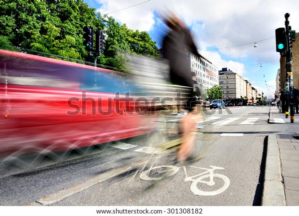 Motion blurred bike and\
other traffic