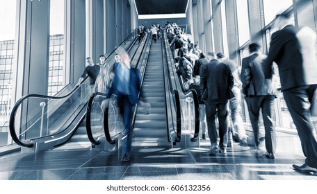 Motion Blurred business on a escalator