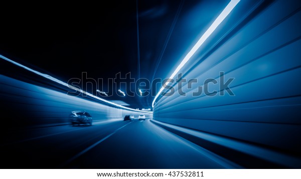 motion blurred car in\
tunnel