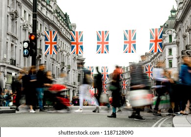 Motion Blurred Crowds Of People On Busy London Shopping Street