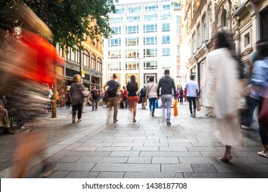 Motion Blurred Crowds Of Shoppers On Busy London Street