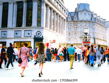 Motion Blurred Crowds Of Shoppers On Busy London Street