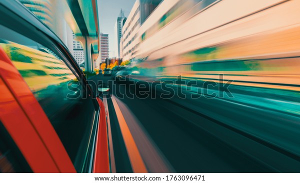 Motion\
blurred drive through the streets of Tokyo,\
Japan