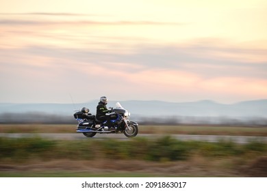 Motion Blurred Image Of Motorcycle Driving Fast On Evening Road. Kyiv, Ukraine - October 12, 2021.