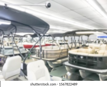 Motion Blurred Inside A Large Boat Dealer Selling Variety Of New And Used Boats Near Dallas, Texas, USA. Recreational Boating Buying, Trade-in And Servicing Concept