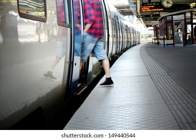 Motion blurred man entering train