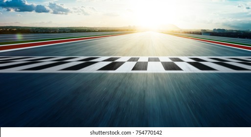 Motion blurred racetrack with start or end line .