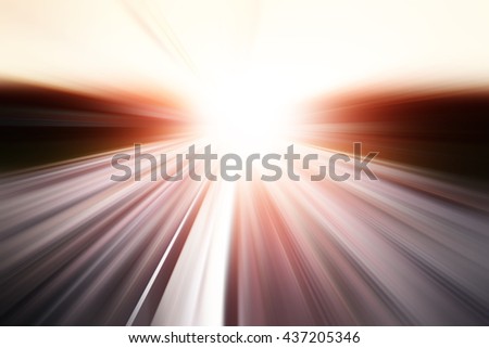 Motion blurred road during sunset.