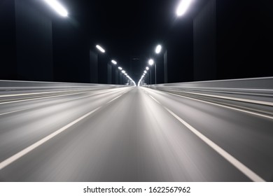 The motion blurred road surface of the bridge photographed on the driving car