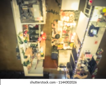 Motion Blurred Top Down View Compact Juice Bar And Café In US Shopping Mall. Blurry Food Kiosk Booth Counter With Bartenders Mixing The Beverage