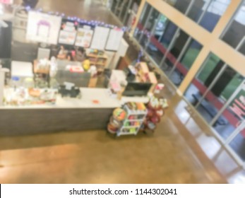 Motion Blurred Top Down View Compact Juice Bar And Café In US Shopping Mall. Blurry Food Kiosk Booth Counter With Bartenders Mixing The Beverage