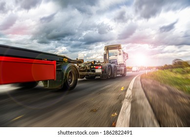 Motion blurred trucks on highway.   Logistics and transportation