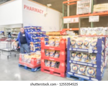 Motion Blurred Warehouse Staff Stocking Goods. Defocused Big-box Store Aisle Shelves In America