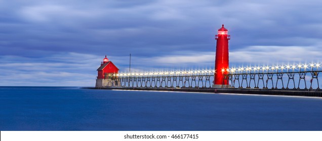 Motion blurred water at the Grand Haven South Pierhead Lighthouse before sunrise, Grand Haven Michigan, USA