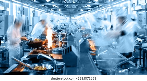 Motion chefs working in Chinese restaurant kitchen - Powered by Shutterstock