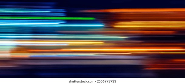 Motion of colorful trail lights. Abstract Rainbow light trails on the dark background