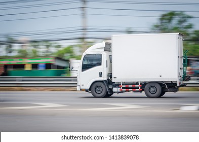 Motion Image, Small White Truck For Logistics On The Road.