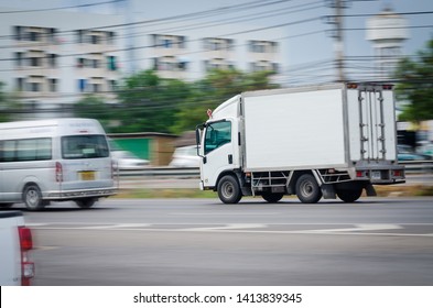 Motion Image, Small White Truck For Logistics On The Road.