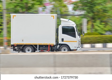 Motion Image Of A Small White Truck For Road Running Transportation