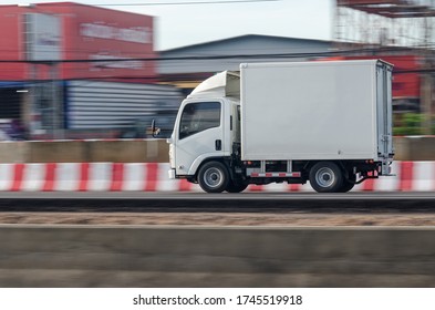 Motion Image Of A Small White Truck For Road Running Transportation