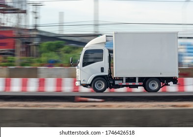 Motion Image Of A Small White Truck For Road Running Transportation