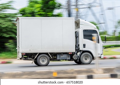 Motion,small White Truck For Logistics On The Road.