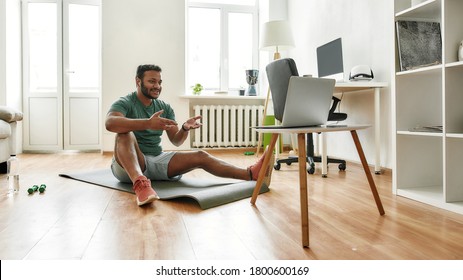 Motivate. Male Fitness Instructor Explaining Exercises While Streaming, Broadcasting Video Lesson On Training At Home Using Laptop. Sport, Online Gym Concept. Web Banner