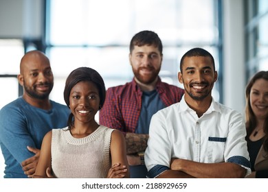 Motivated, ambitious and proud creative team of men and women standing with arms folded to show unity, power and teamwork. Portrait of happy diverse group of business people feeling united together - Shutterstock ID 2188929659