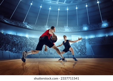 Motivated and competitive young men, basketball players in motion during match, game playing at 3D arena with flashlights. Concept of professional sport, competition, action, hobby, game. - Powered by Shutterstock