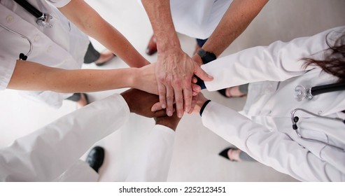 Motivated Team Of Diverse Hospital Doctors Hands - Powered by Shutterstock