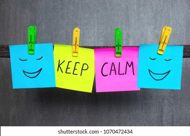 Motivation concept, notes with words Keep calm on the dark background. - Shutterstock ID 1070472434