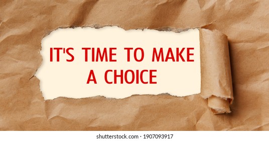 Motivation Encouragement Quote. Text - It's Time To Make A Choice - Appearing Behind Torn Brown Paper.