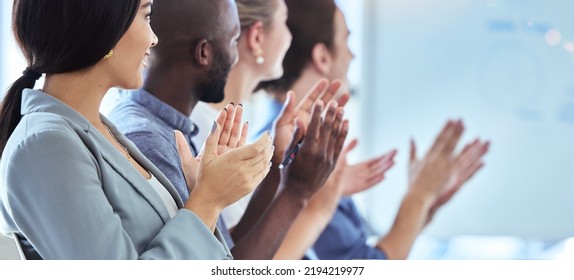 Motivation, innovation and community support by clapping workers at a conference or presentation. Diverse team applause, cheering and inspired at a training seminar or meeting, positive audience - Shutterstock ID 2194219977