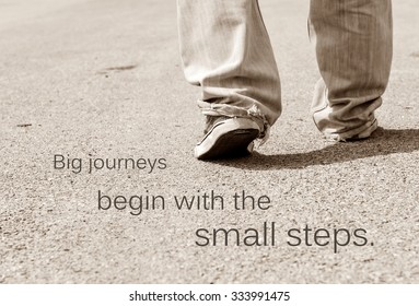 Motivation quote on soft background, BIG JOURNEYS BEGIN WITH THE SMALL STEP.