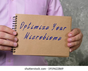 Motivational Concept About Optimize Your Microbiome With Sign On The Piece Of Paper.
