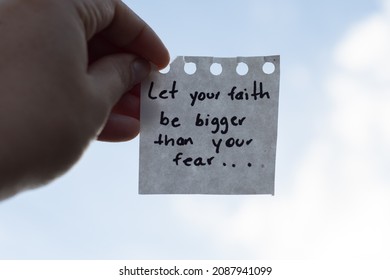 Motivational phrase to fight fear. Phrase for sad days not to decay. Blurred background of clouds and bright,