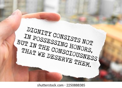 Motivational quote. Dignity consists not in possessing honors, but in the consciousness that we deserve them. - Shutterstock ID 2250888385