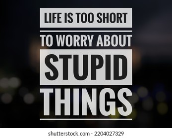 Motivational quote "Life is too short to worry about stupid things" on abstract dark background. - Shutterstock ID 2204027329