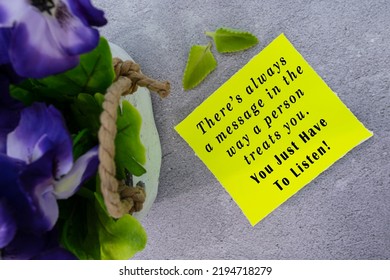 Motivational Quote On Yellow Note With Flowers - There's Always A Message In The Way A Person Treats You. You Just Have To Listen.