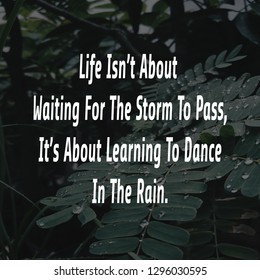 motivational quote,life isn't about waiting for the storm to pass,it's about learning to dance in the rain - Shutterstock ID 1296030595