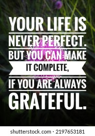 Motivational Sentence With Pink Flower Background. Your Life Is Never Perfect. But You Can Make It Complete, If You Are Always Grateful.