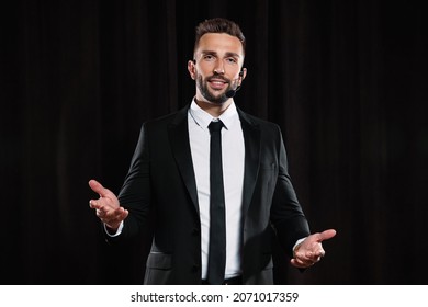 Motivational Speaker With Headset Performing On Stage