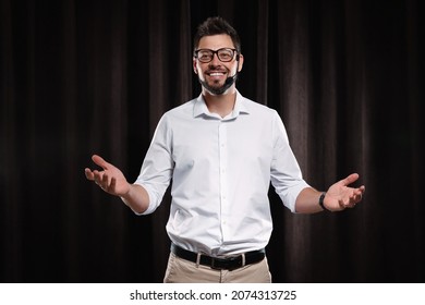 Motivational Speaker With Headset Performing On Stage