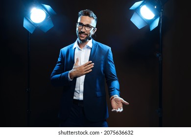 Motivational Speaker With Headset Performing On Stage