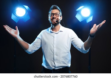 Motivational Speaker With Headset Performing On Stage