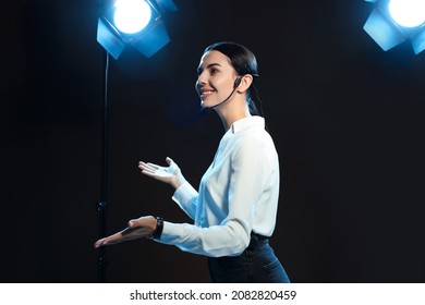 Motivational Speaker With Headset Performing On Stage