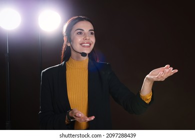 Motivational Speaker With Headset Performing On Stage