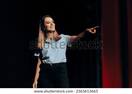
Motivational Speaker Pointing to a Person in the Audience. Cheerful speaker choosing someone in the crowd to make an example
